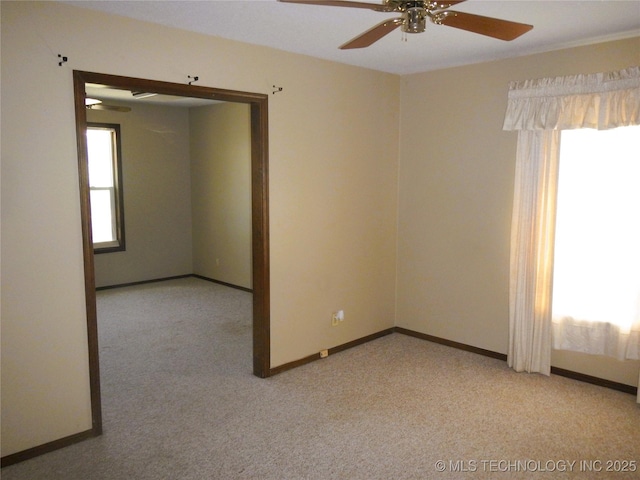 110 W 8th St, So Coffeyville, OK 74072 - unfurnished room featuring a ceiling fan, healthy amount of natural light, and light carpet