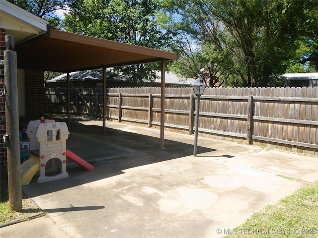 110 W 8th St, So Coffeyville, OK 74072 - view of patio featuring fence