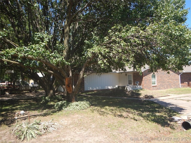 110 W 8th St, So Coffeyville, OK 74072 - view of front of house with brick siding