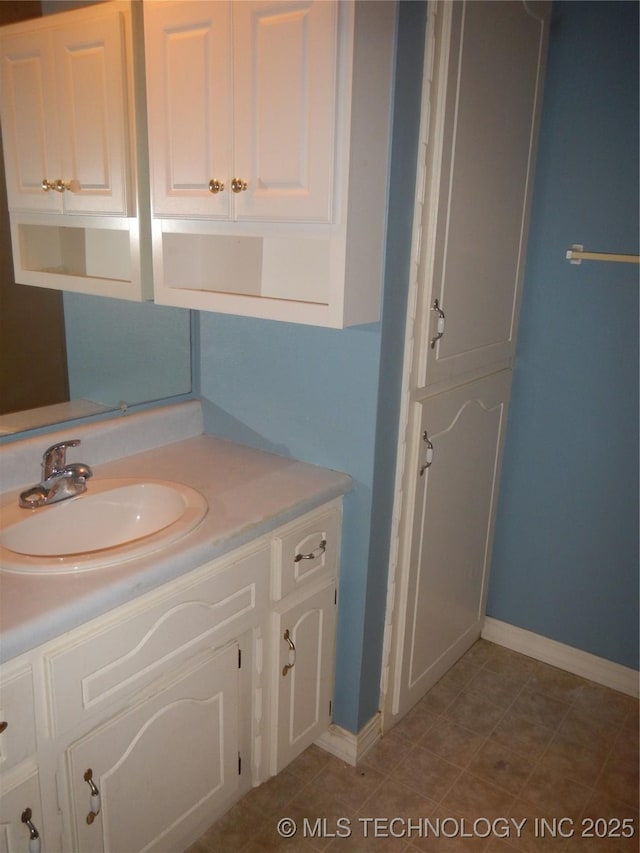110 W 8th St, So Coffeyville, OK 74072 - bathroom featuring vanity and baseboards