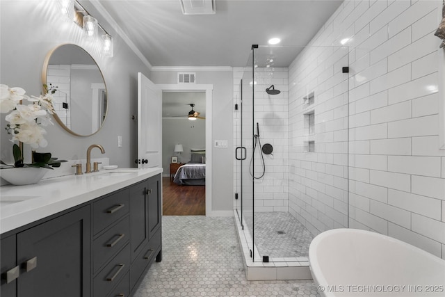 3478 S Gary Ave, Tulsa, OK 74105 - bathroom featuring a freestanding bath, a ceiling fan, a shower stall, double vanity, and crown molding