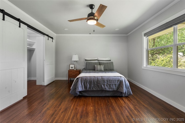 3478 S Gary Ave, Tulsa, OK 74105 - bedroom with a barn door, baseboards, wood finished floors, crown molding, and ceiling fan
