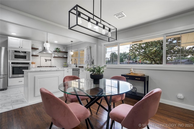 3478 S Gary Ave, Tulsa, OK 74105 - dining room with ornamental molding and baseboards