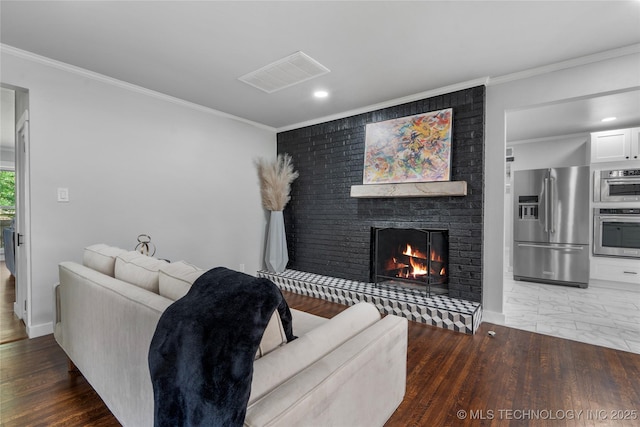 3478 S Gary Ave, Tulsa, OK 74105 - living area featuring a brick fireplace, crown molding, recessed lighting, and baseboards