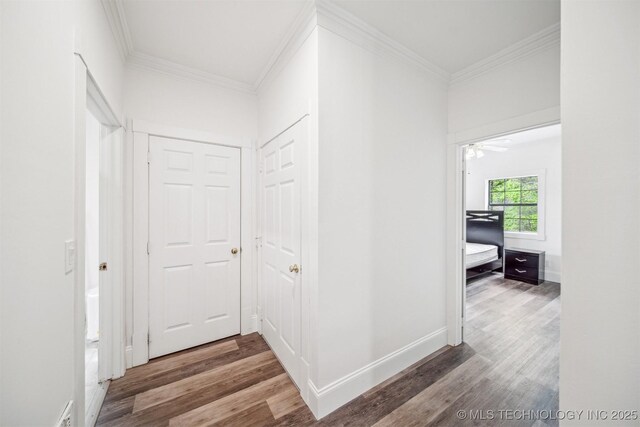 1001 County Road 2265, Skiatook, OK 74070 - hallway with wood finished floors, crown molding, and baseboards