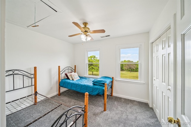 1001 County Road 2265, Skiatook, OK 74070 - carpeted bedroom featuring attic access, baseboards, and a ceiling fan
