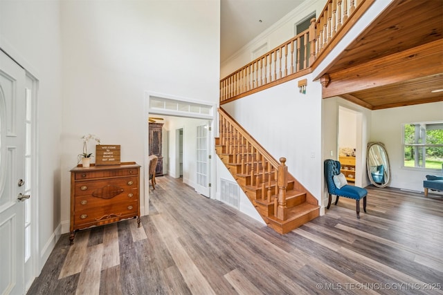 1001 County Road 2265, Skiatook, OK 74070 - foyer entrance featuring stairway, wood finished floors, a high ceiling, and baseboards