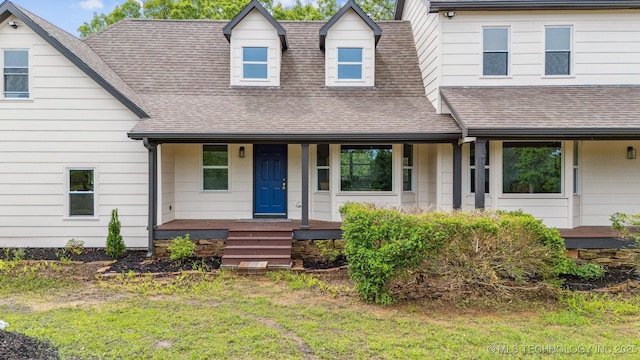 1001 County Road 2265, Skiatook, OK 74070 - view of front of home with covered porch, a shingled roof, and a front lawn