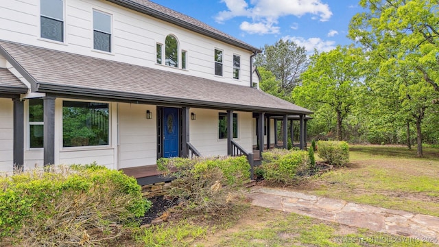 1001 County Road 2265, Skiatook, OK 74070 - view of front of home with a porch and a shingled roof