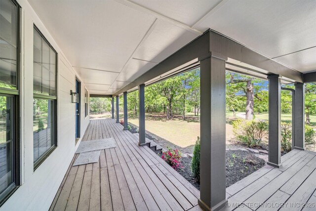 1001 County Road 2265, Skiatook, OK 74070 - wooden deck with a porch