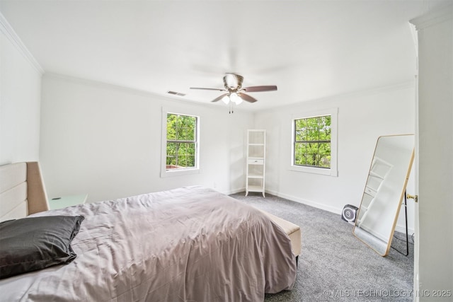 1001 County Road 2265, Skiatook, OK 74070 - bedroom featuring ornamental molding, carpet, multiple windows, baseboards, and ceiling fan