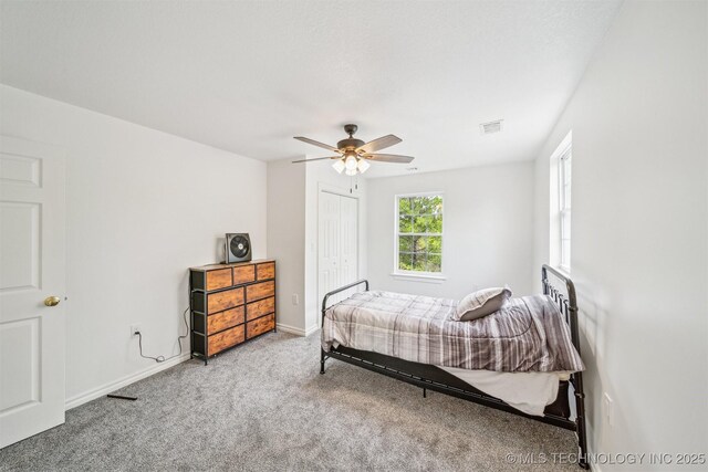 1001 County Road 2265, Skiatook, OK 74070 - carpeted bedroom featuring a ceiling fan, a closet, and baseboards