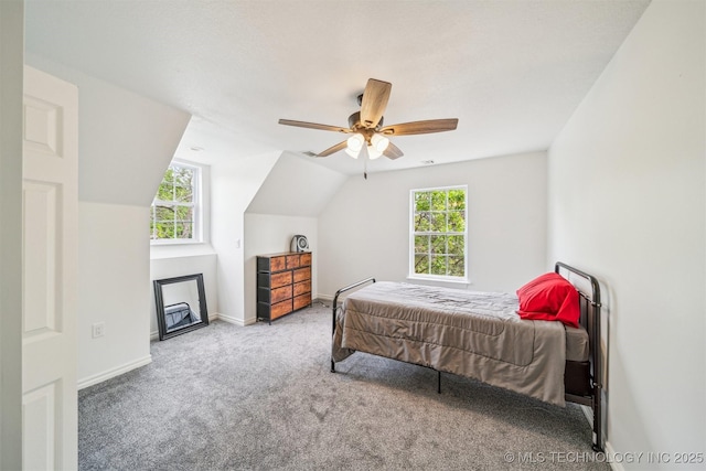 1001 County Road 2265, Skiatook, OK 74070 - bedroom featuring carpet floors, multiple windows, baseboards, ceiling fan, and lofted ceiling