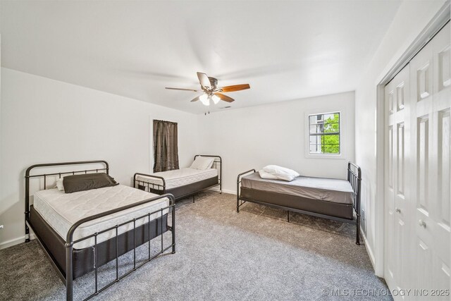 1001 County Road 2265, Skiatook, OK 74070 - bedroom featuring carpet flooring, a ceiling fan, and baseboards