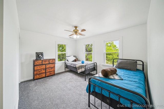 1001 County Road 2265, Skiatook, OK 74070 - bedroom with carpet, a ceiling fan, and baseboards