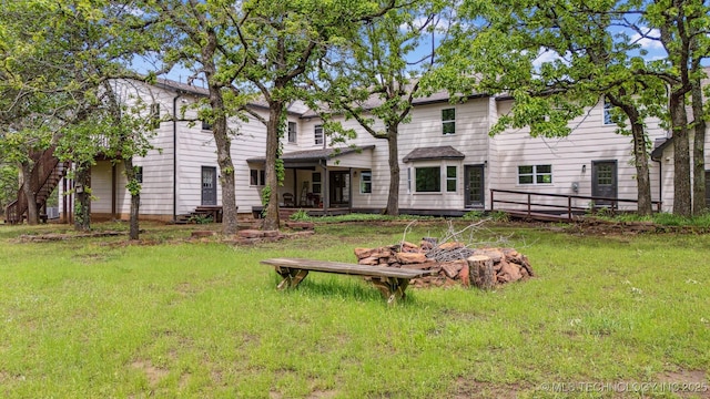 1001 County Road 2265, Skiatook, OK 74070 - back of house featuring a sunroom