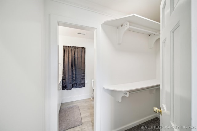 1001 County Road 2265, Skiatook, OK 74070 - spacious closet featuring wood finished floors