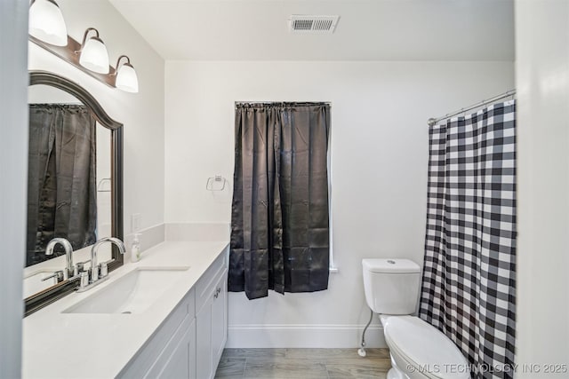 1001 County Road 2265, Skiatook, OK 74070 - full bathroom featuring vanity, toilet, and baseboards