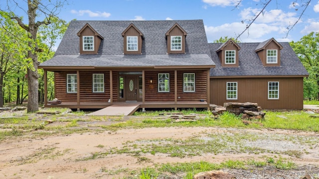 1001 County Road 2265, Skiatook, OK 74070 - log home featuring covered porch and a shingled roof