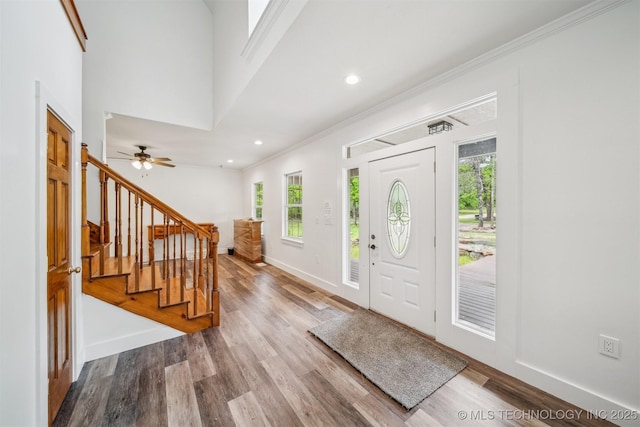 1001 County Road 2265, Skiatook, OK 74070 - foyer entrance featuring baseboards, wood finished floors, stairway, ornamental molding, and recessed lighting