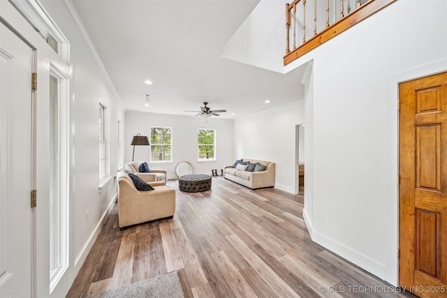 1001 County Road 2265, Skiatook, OK 74070 - living area with baseboards, wood finished floors, recessed lighting, ceiling fan, and ornamental molding