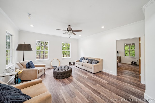 1001 County Road 2265, Skiatook, OK 74070 - living room with crown molding, healthy amount of natural light, wood finished floors, baseboards, and recessed lighting