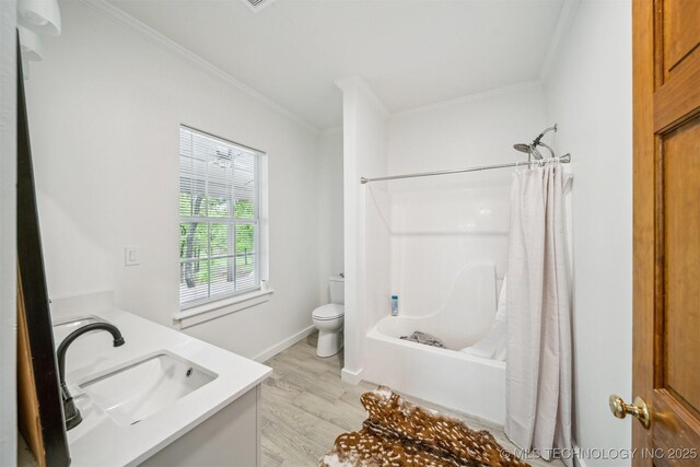 1001 County Road 2265, Skiatook, OK 74070 - bathroom featuring ornamental molding, wood finished floors, toilet, vanity, and shower / tub combo with curtain