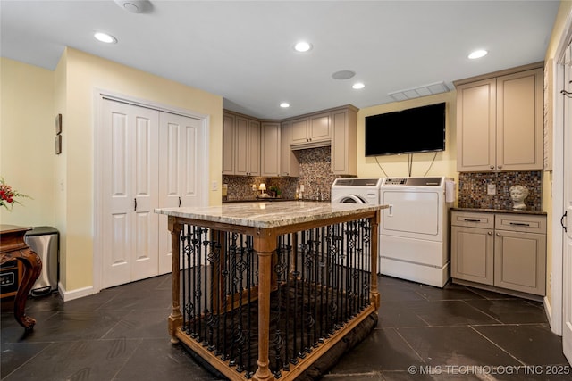 4728 S Atlanta Pl, Tulsa, OK 74105 - kitchen featuring washing machine and dryer, tasteful backsplash, recessed lighting, baseboards, and light stone countertops