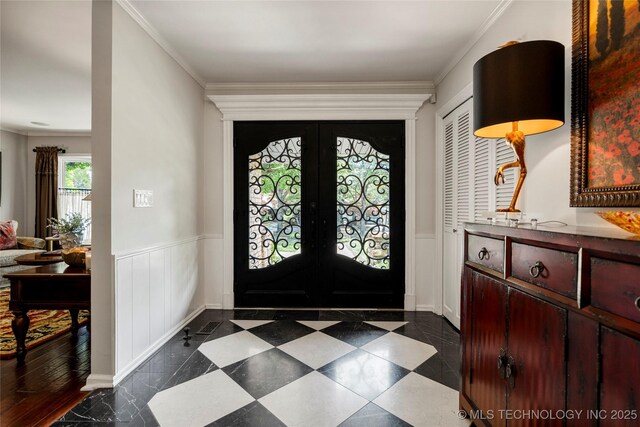 4728 S Atlanta Pl, Tulsa, OK 74105 - foyer with a wainscoted wall, crown molding, french doors, and a decorative wall