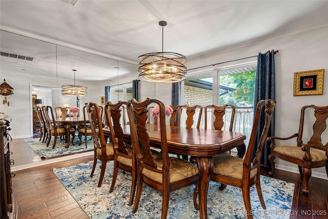 4728 S Atlanta Pl, Tulsa, OK 74105 - dining area with hardwood / wood-style flooring, a chandelier, ornamental molding, and baseboards