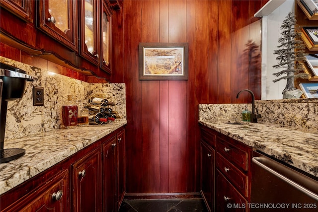 4728 S Atlanta Pl, Tulsa, OK 74105 - kitchen featuring dark brown cabinets, stainless steel dishwasher, decorative backsplash, light stone countertops, and a sink