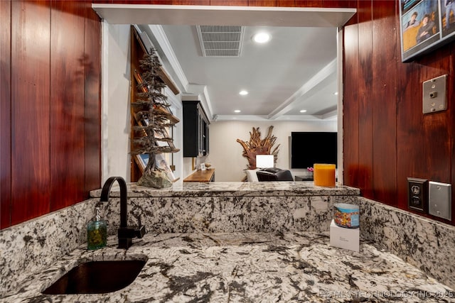 4728 S Atlanta Pl, Tulsa, OK 74105 - kitchen featuring a sink, light stone countertops, recessed lighting, and crown molding