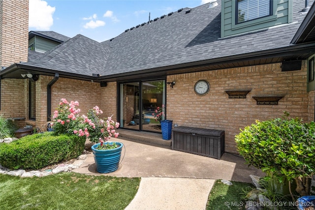 4728 S Atlanta Pl, Tulsa, OK 74105 - entrance to property featuring roof with shingles and brick siding
