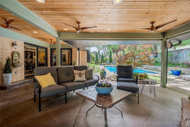 4728 S Atlanta Pl, Tulsa, OK 74105 - view of patio with ceiling fan, an outdoor living space, and an outdoor pool