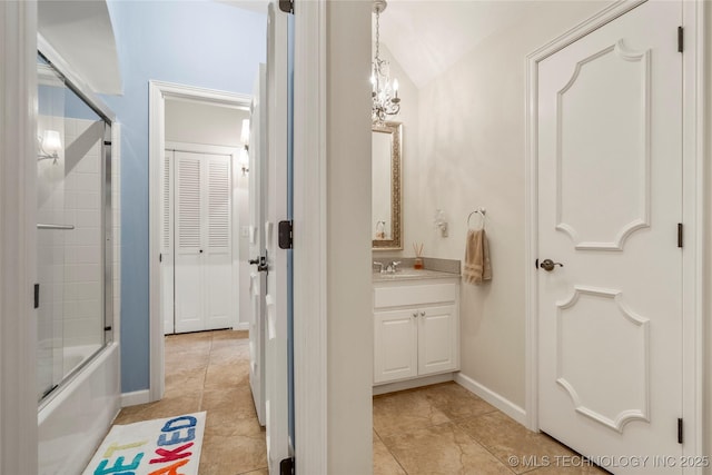 4728 S Atlanta Pl, Tulsa, OK 74105 - bathroom featuring vanity, shower / bath combination with glass door, tile patterned floors, and baseboards