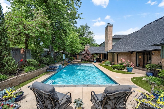 4728 S Atlanta Pl, Tulsa, OK 74105 - view of swimming pool with a fenced backyard and a patio