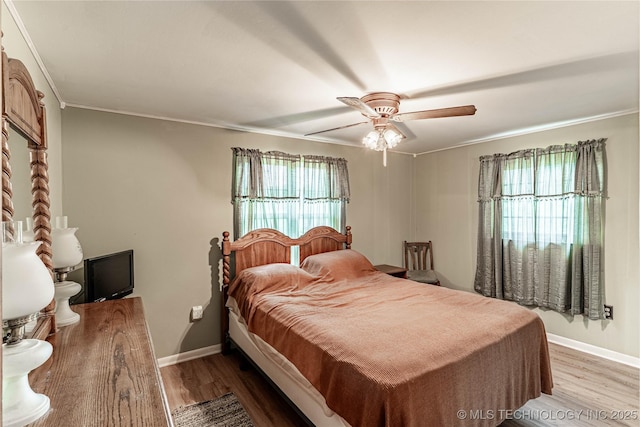 34047 W 191st St S, Bristow, OK 74010 - bedroom with wood finished floors, crown molding, baseboards, and ceiling fan
