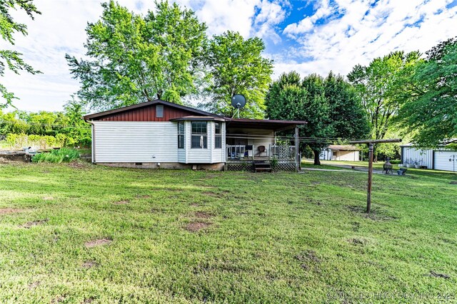 34047 W 191st St S, Bristow, OK 74010 - rear view of property with crawl space, a lawn, and a wooden deck