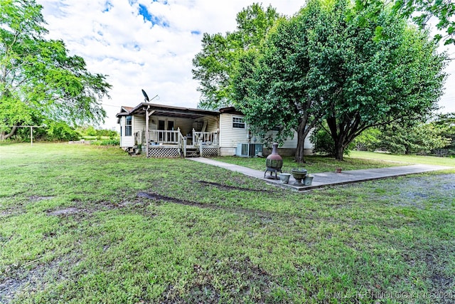 34047 W 191st St S, Bristow, OK 74010 - view of green lawn featuring central air condition unit and a deck