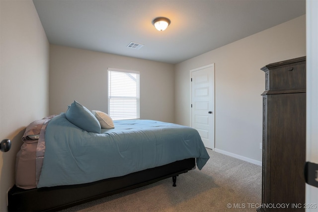 carpeted bedroom featuring baseboards