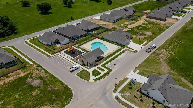 aerial perspective of suburban area featuring a pool area