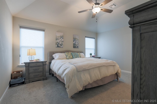 bedroom with carpet flooring, vaulted ceiling, baseboards, and ceiling fan