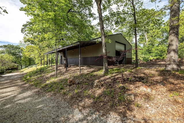 32290 S 630th Rd, Jay, OK 74346 - view of home's exterior featuring a garage, an outdoor structure, and a pole building