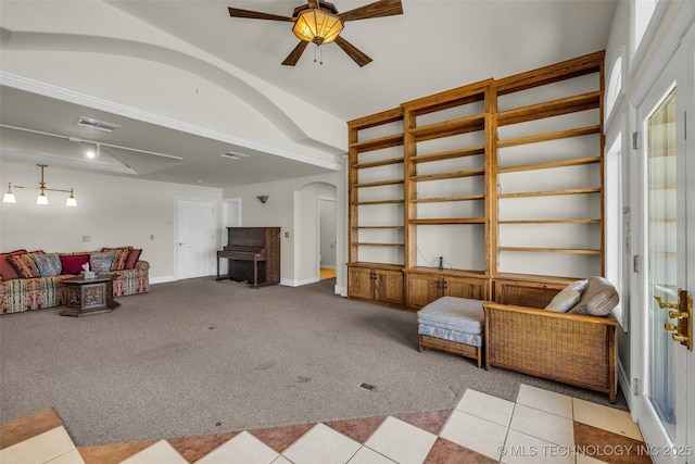 32290 S 630th Rd, Jay, OK 74346 - living room with arched walkways, carpet flooring, ceiling fan, baseboards, and built in shelves