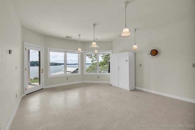 32290 S 630th Rd, Jay, OK 74346 - unfurnished dining area featuring baseboards, a water view, and light flooring