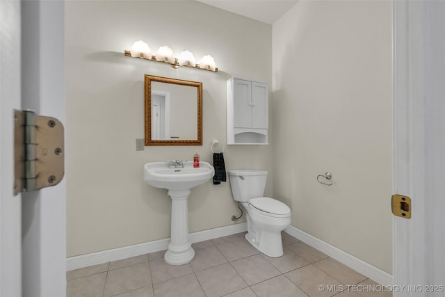 32290 S 630th Rd, Jay, OK 74346 - bathroom featuring toilet, baseboards, tile patterned flooring, and a sink