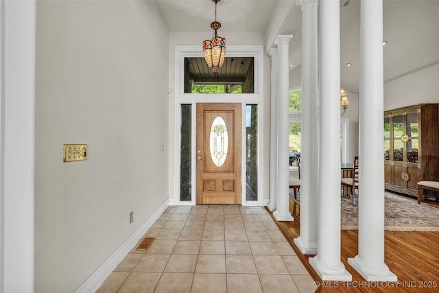 32290 S 630th Rd, Jay, OK 74346 - foyer featuring decorative columns, a high ceiling, light tile patterned flooring, and baseboards