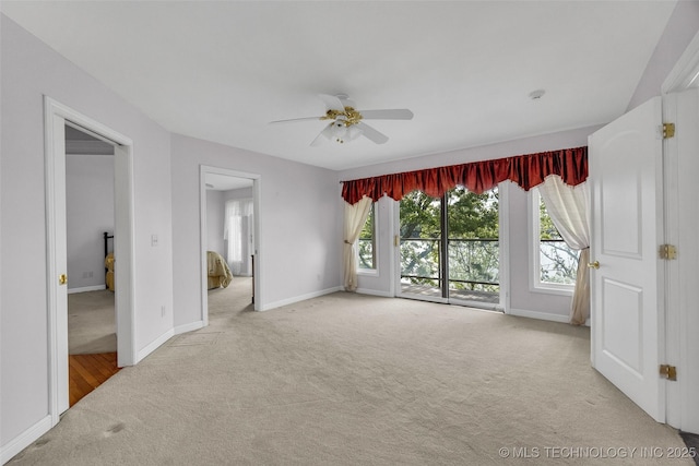 32290 S 630th Rd, Jay, OK 74346 - unfurnished bedroom with carpet floors, access to exterior, baseboards, and ceiling fan