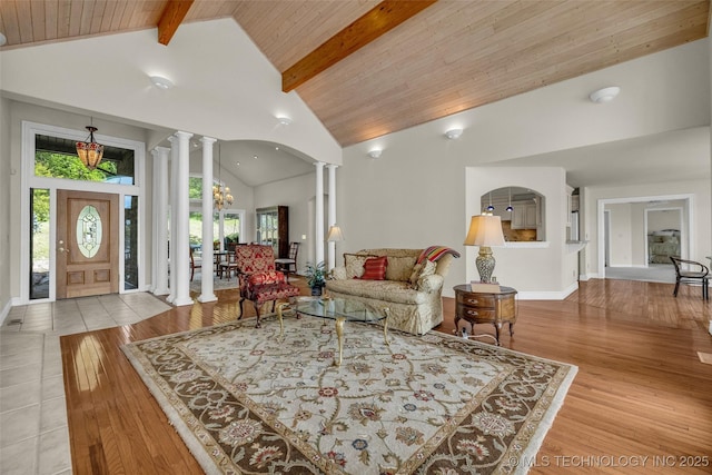 32290 S 630th Rd, Jay, OK 74346 - living area featuring ornate columns, beam ceiling, high vaulted ceiling, wood finished floors, and wood ceiling