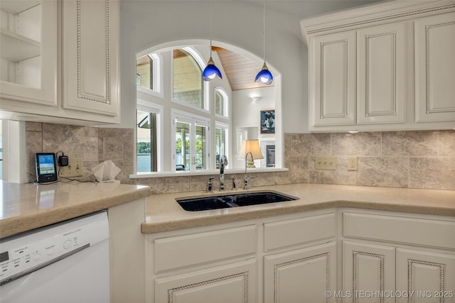 32290 S 630th Rd, Jay, OK 74346 - kitchen with dishwasher, a sink, backsplash, vaulted ceiling, and glass insert cabinets
